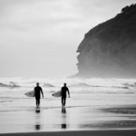 Surfers at Piha Beach. Photo: Daniele Sartori/Fotopedia